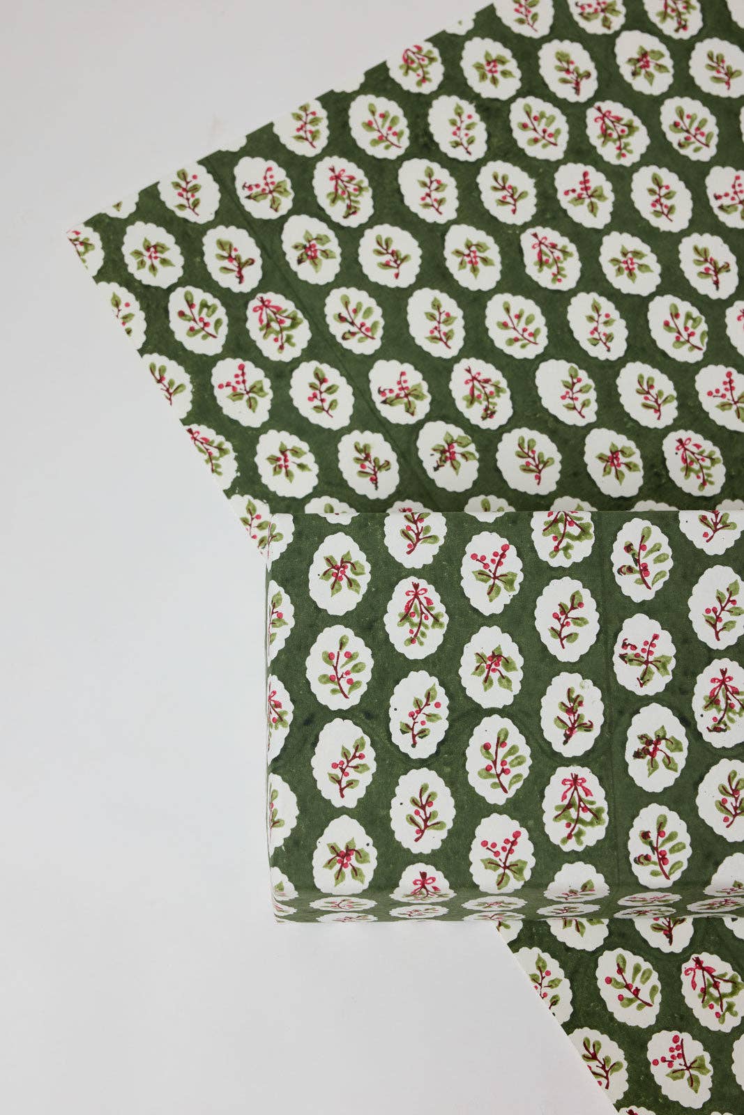 Block printed wrapping paper in Scallop Tiles Holly Green