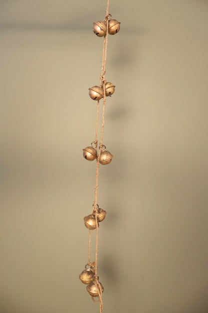 Bijou Rustic Bell Garland: a strand of small antique gold jingle bells knotted along natural jute cord