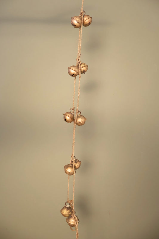 Bijou Rustic Bell Garland: a strand of small antique gold jingle bells knotted along natural jute cord