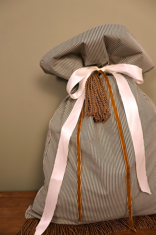 Green striped Santa sack with a cream satin ribbon, caramel velvet ribbon and gold tassel