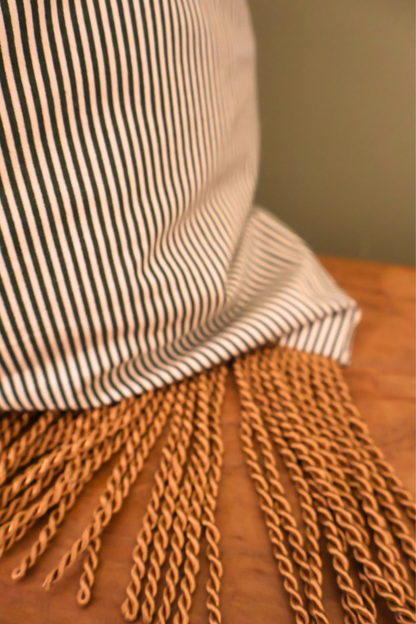 Gold bullion fringe trim at the base of the green striped Santa sack